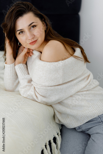 Woman in Cream Sweater Portrait. Cozy Female Portrait