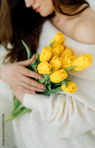 Woman Holding Yellow Tulips Bouquet