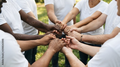 Fotografie Diverse team collaboration hands united in a circle representing unity and suppo