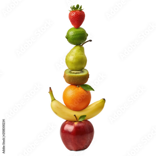 Stack of assorted fresh fruits including strawberry banana orange kiwi pear lime isolated on transparent background
