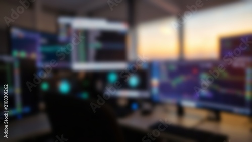 Cybersecurity team monitors glowing screens inside dark security room