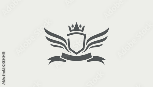 Crest style heraldic logo template featuring a shield with spread wings and a royal crown on a greyish background.