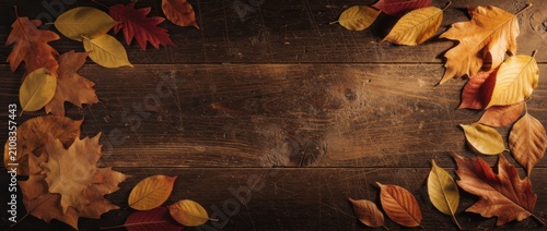 Autumn Leaves on Wooden Surface with Rich Colors Creating a Seasonal Atmosphere for Fall Decor and Nature Background Inspiration