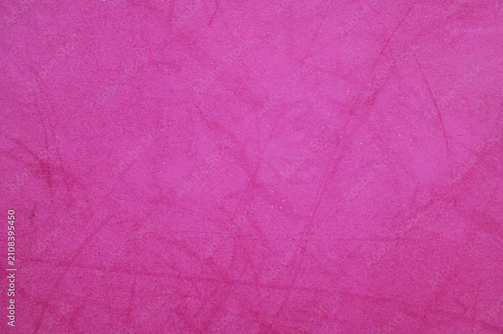 Fototapeta premium Bright fuchsia pink textured surface with subtle variations and soft feel