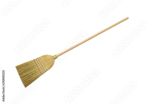 Konstfotografi Traditional straw broom with a long wooden handle for cleaning floors