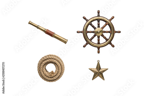 Nautical collection featuring a brass spyglass, ship wheel, coiled rope, and a star ornament isolated on a clean white background