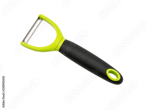 Bild auf Leinwand Stylish green and black vegetable peeler on a black background