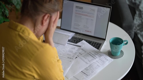 Stressed woman having financial problems with paying bills.