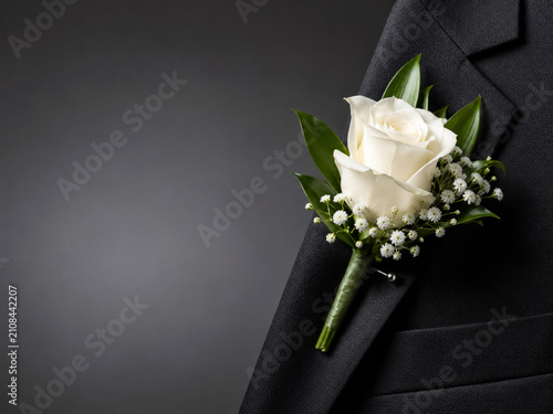 Elegant wedding boutonniere on suit jacket