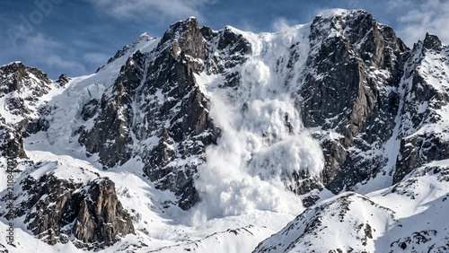 HDR photography of a massive terrifying deep snow avalanche plunging down a rugged mountain face