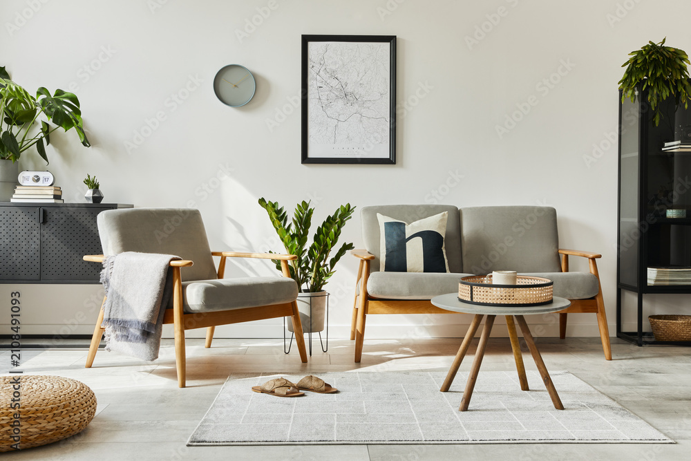 Fototapeta premium Modern retro concept of home interior with design sofa, armchair, coffee table, plants, mock up poster map, carpet and personal accessoreis. Stylish home decor of living room.
