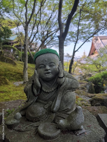 Miyajima Island Stone Statue with Green Hat at Itsukushima
