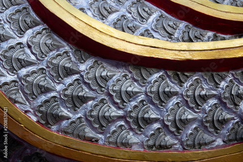 Naga scales on a statue in a Thai temple.