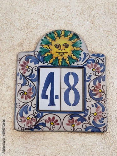 Hand painted ceramic tiles that say number 48