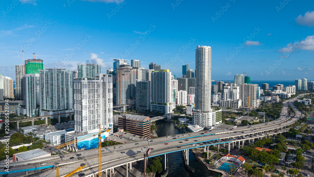 Fototapeta premium Aerial view of downtown Miami skyline with highway interchange and skyscrapers