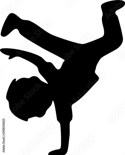 Silhouette of a Young Boy Performing a Breakdance Freeze Pose