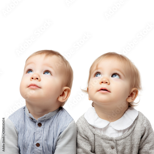 Large red bead necklace with po - Two adorable babies wearing soft white headbands lying side by side on a cozy white bed on transparent png background. Ai generated