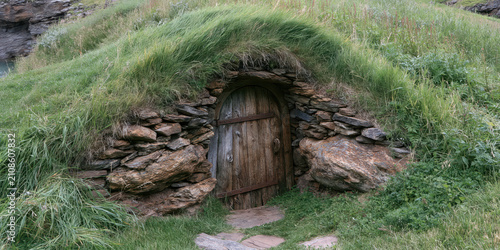 Rustic Stone Doorway Nestled in Lush Grassland