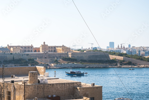 Fort Manoel on Manoel Island and Luzzu boat in Marsamxett Harbour, Valletta MALTA