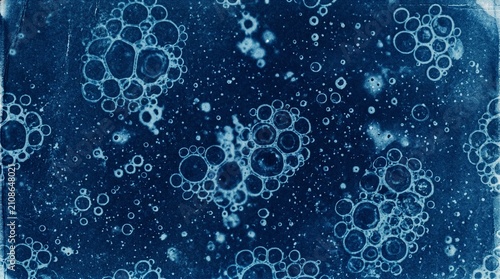 Vintage cyanotype print texture with abstract soap bubbles and cell clusters, Prussian blue grunge background art
