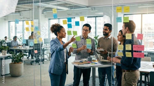Business team conducting project brainstorming session in modern open concept office space with sticky notes problem solving brainstorming teamwork business strategy