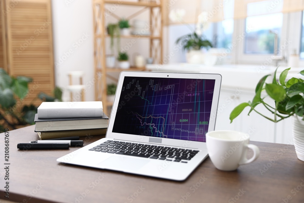 Fototapeta premium Comfortable workplace with laptop on wooden table indoors