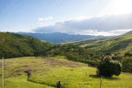 Принти на полотні Rogue Valley during a beautiful green spring day, with Ashland being shadowed by a cloud