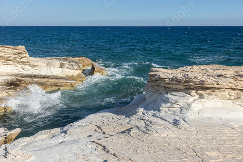 Waves Crashing Against White Limestone Cliffs on a Rocky Mediterranean Coastline