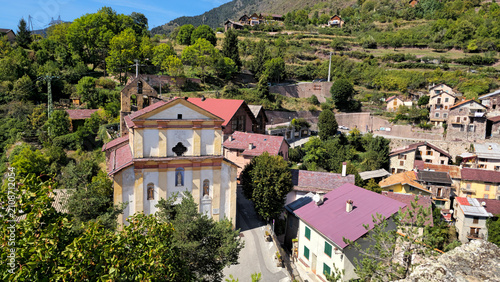 Roure village with Eglise Saint Laurent church nestled in a scenic mountain landscape, Maritime Alps, France, Europe.