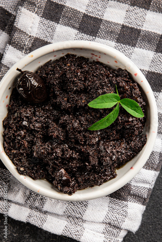 Tapenade black olives olive spread ready to eat tasty snack fresh and delicious gourmet food background rustic food on the table top view copy space