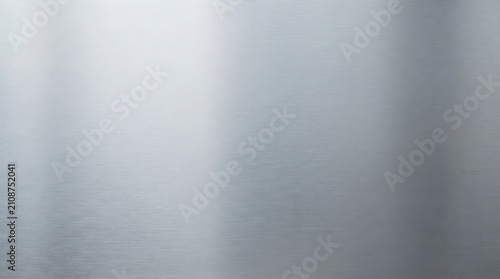 Brushed silver metallic texture seamless background. Industrial reflective surface for modern design and high-tech visuals.
