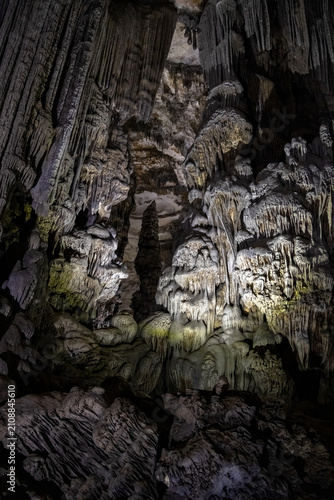Cave Formations Dramatically Lit by Yellow-Green Spotlights in Les Grottes des Beni Add Cavern