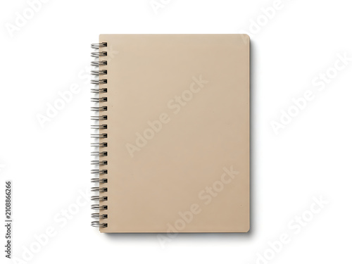 Blank beige spiral notebook with metal rings isolated on white background