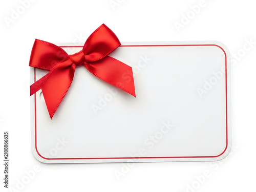 Blank gift tag with a festive red bow isolated on white background