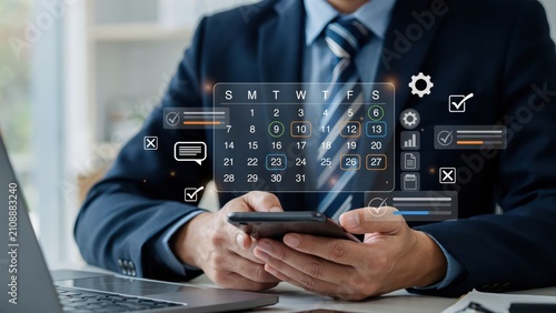 Businessman using a digital calendar interface on a modern office computer screen