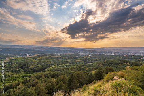 View of the mountains and Kislovodsk from the observation decks of the Kislovodsk Park. Evening sunset over the mountains of Kislovodsk.