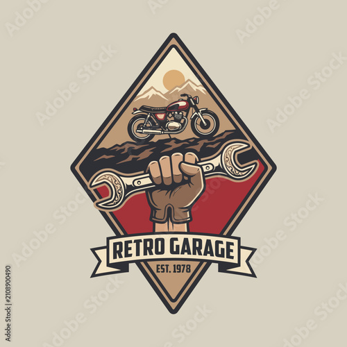 Schilderij op canvas This vintage-inspired logo features a motorcycle alongside a wrench, aptly representing the spirit of retro garages and the artisanal craftsmanship behind them