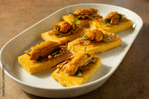 Obraz na plátně A view of a plate of uni canapes.