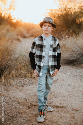 Fall Portrait of Young Boy in Hat and Flannel Shirt