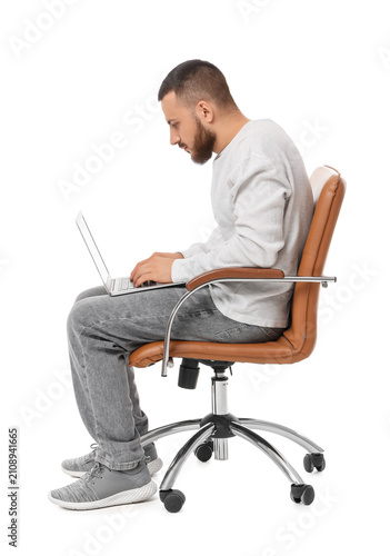Young man sitting on office...