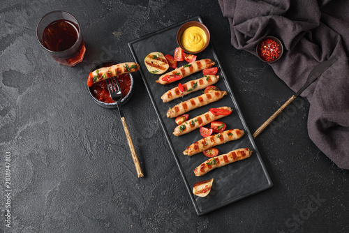 Board with tasty grilled sa...