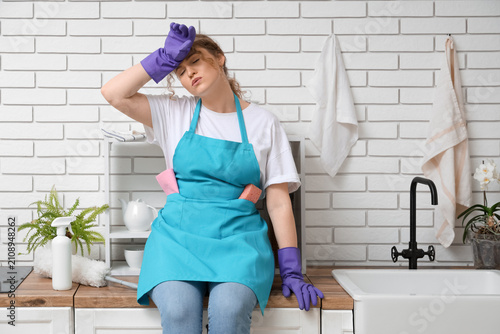 Tired female janitor after ...