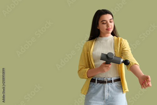 Young woman massaging her a...