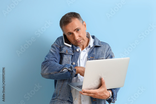 Stressed mature man with la...