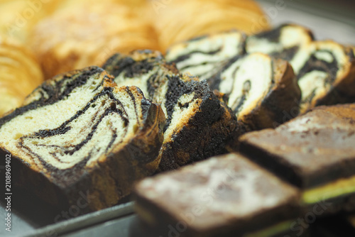 Quadro su tela Bakery display of sweet desserts at a local shop