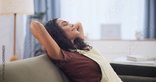 Obraz na płótnie Woman, stretching and relax at house with smile, peace and calm morning for weekend break
