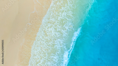 Nature of the ocean and blue sky Summer with sunshine, sandy beaches, clear blue waters sparkling against the blue sky. on an island with good ecology and environment Background for summer vacation