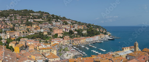 Aerial View of Porto Santo Stefano Harbor with Boats and Coastal Village in Tuscany, Italy