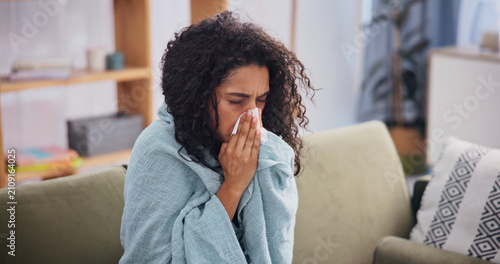 Картината върху платно Blanket, woman and sick with sneeze in home for seasonal allergies, fatigue and respiratory virus