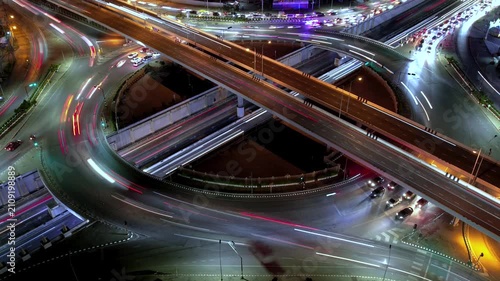 Intersection view above , Expressway top view, Road traffic an important infrastructure, car traffic transportation above intersection road in city night of advanced innovation, financial technology